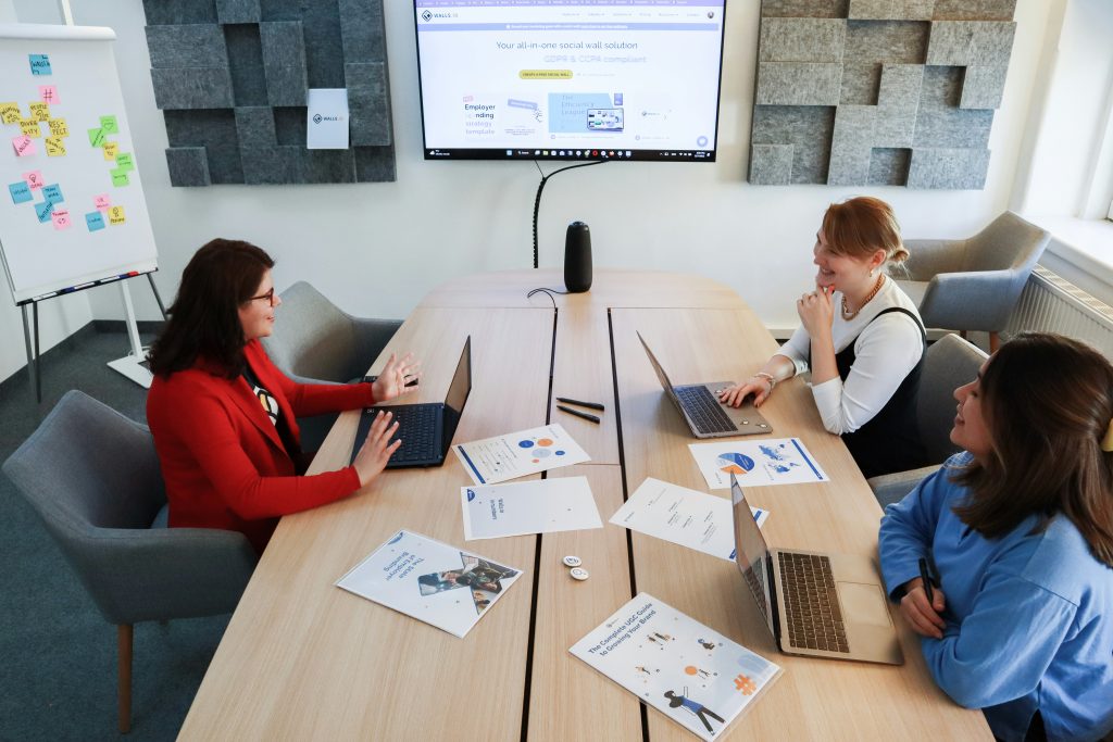 Small business team identifying and reviewing AI adoption solutions and workflow improvements with Loughmore